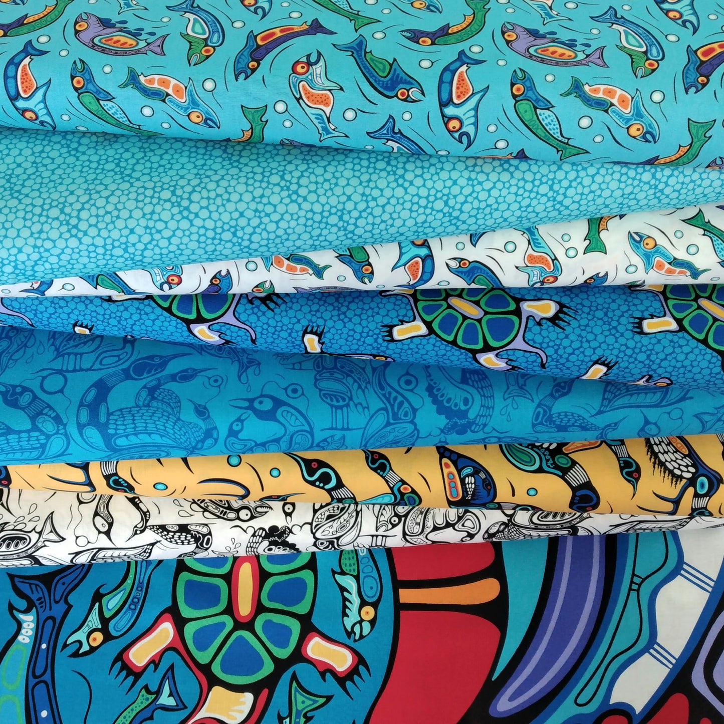 Sacred Earth by Mark Anthony Jacobson Colour: 27110-42 Fish Light Blue Multi