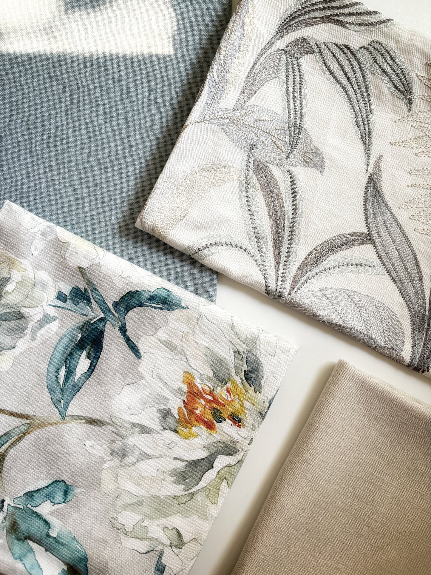 a dreamy floral printed pillow in an illustrated style. Blue and orange hues