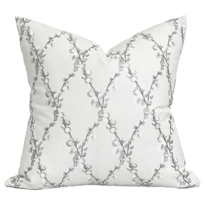 Embroidered floral white pillow with linen fabric background