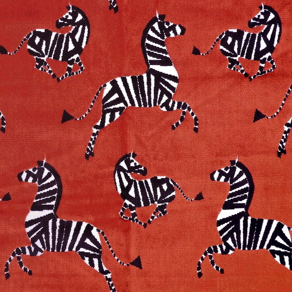 luxury velvet for upholstery with a leaping dancing zebra in black and white