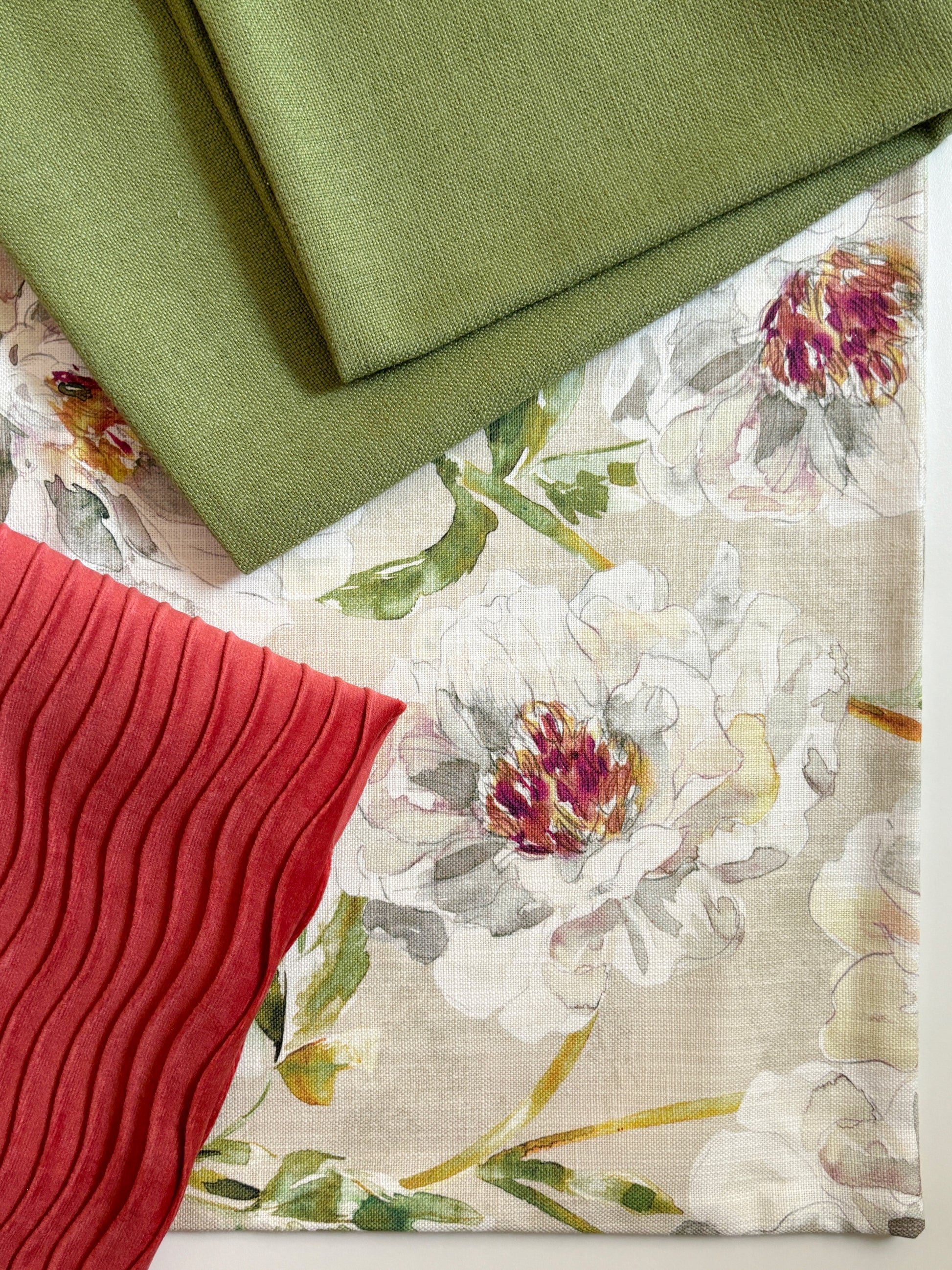 a dreamy floral printed pillow in an illustrated style. Green and pink hues