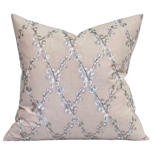 Embroidered floral pink pillow with linen fabric background