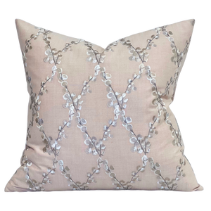 Embroidered floral pink pillow with linen fabric background